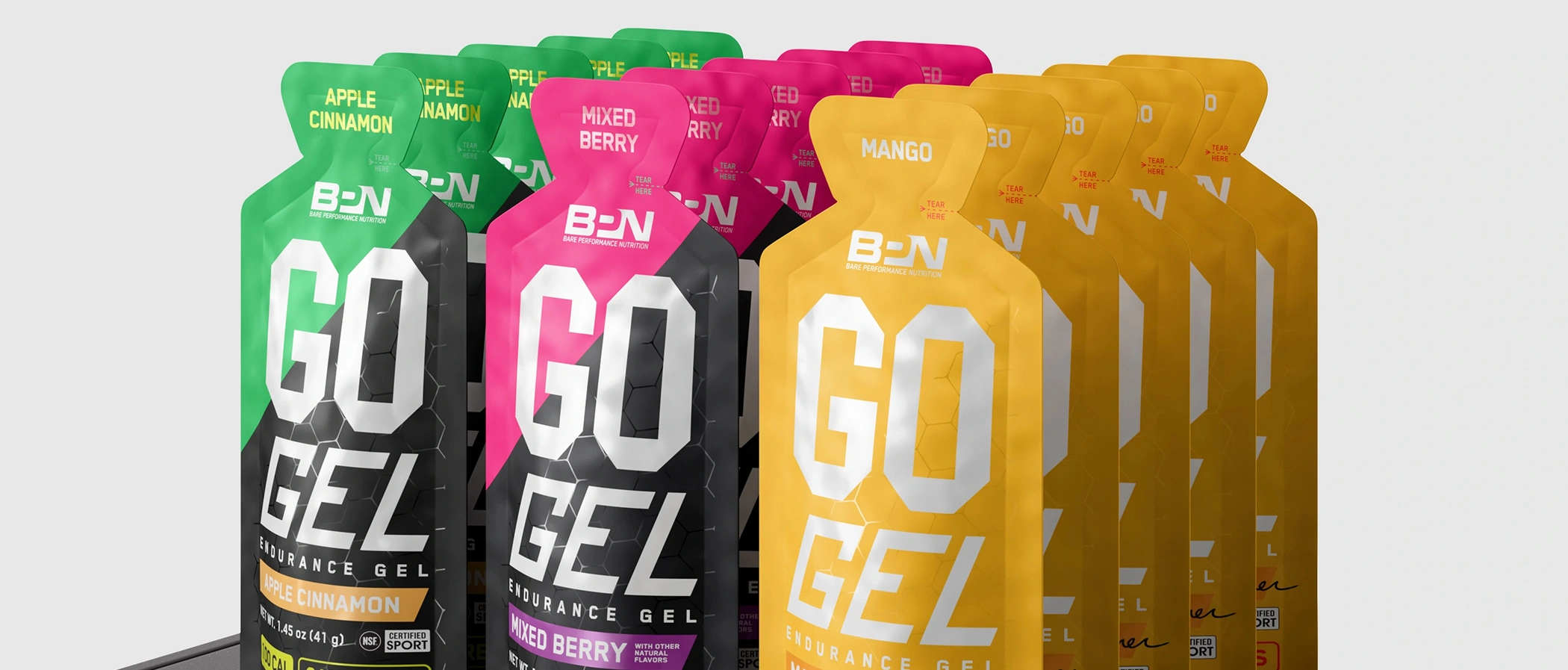 A lineup of matching endurance gel pouches with different colored flavor label variants rendered in 3D