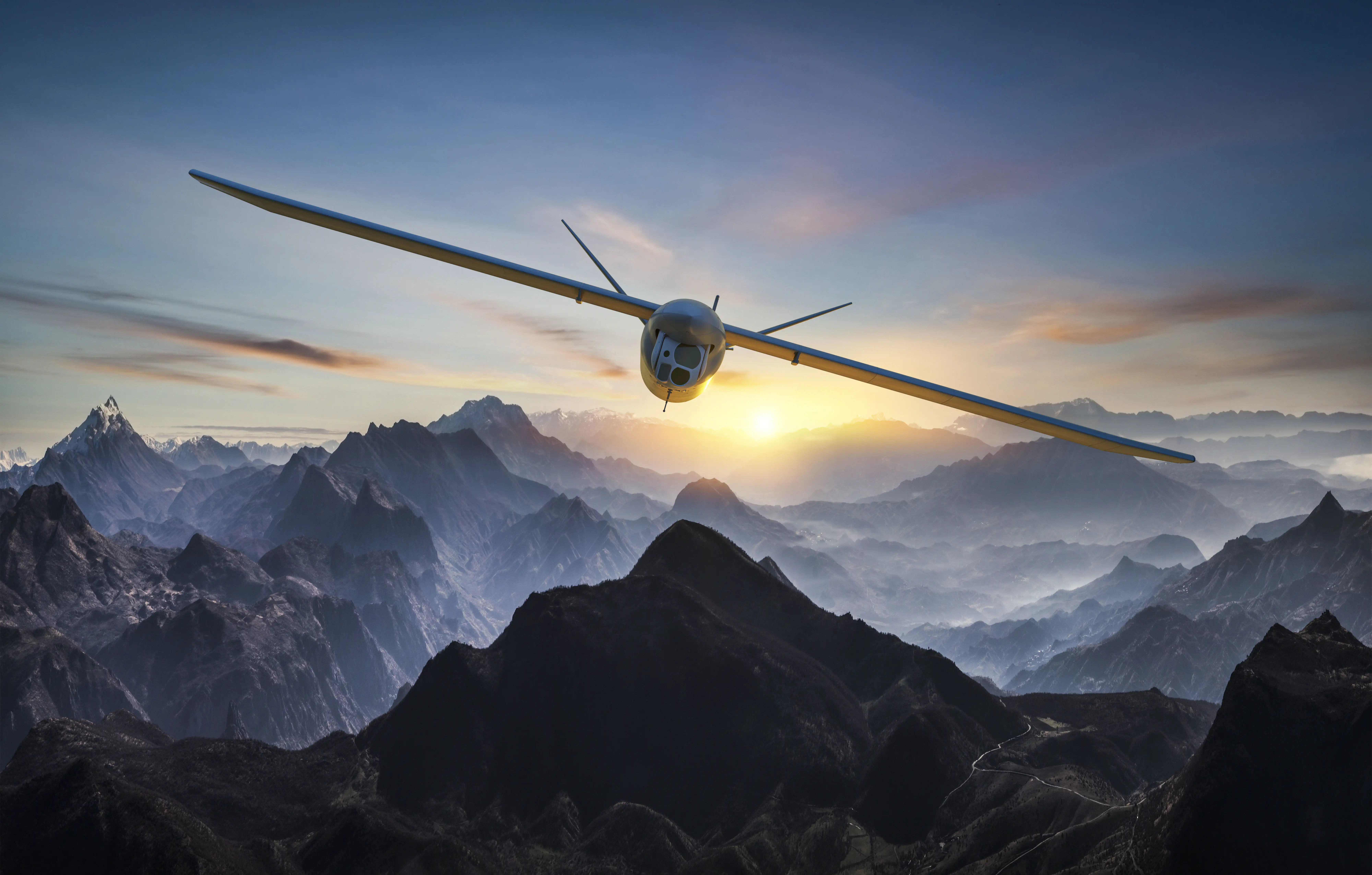 M2 aircraft flying toward the camera over misty mountain peaks at sunrise
