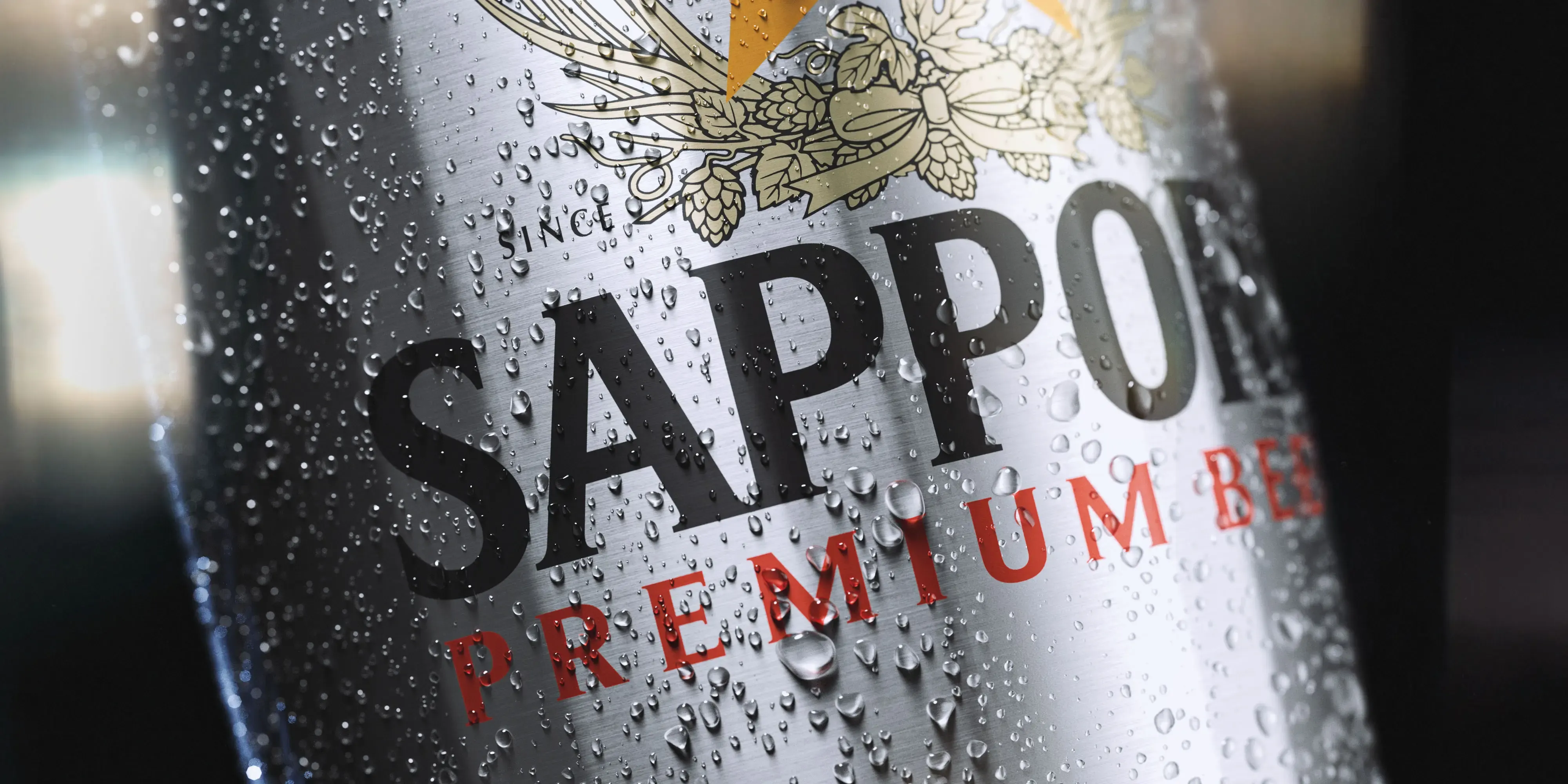 3D render of a close-up of a Sapporo Premium Beer can covered in condensation