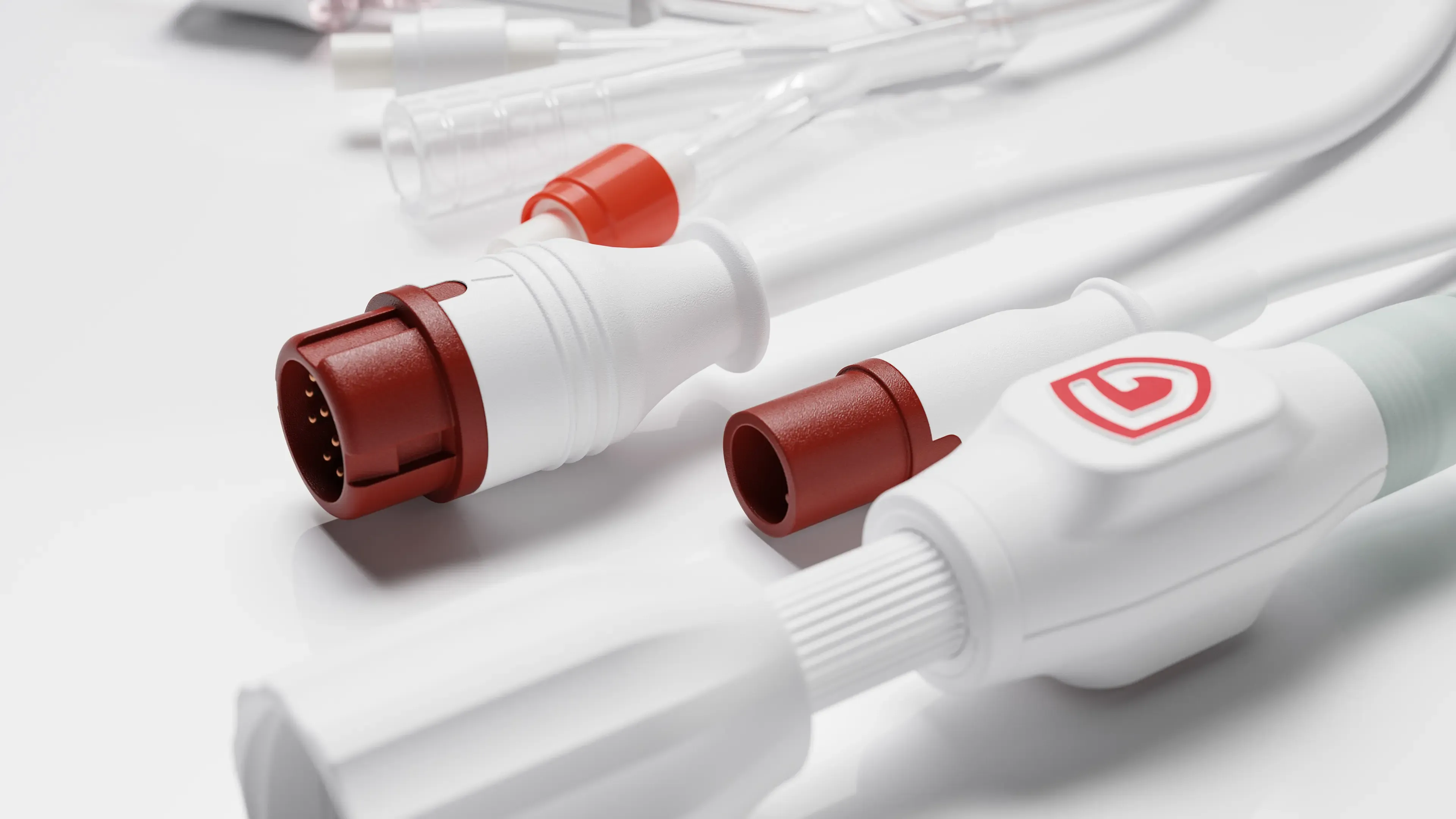 3D render of TraumaGuard catheter connectors with red fittings on a white surface