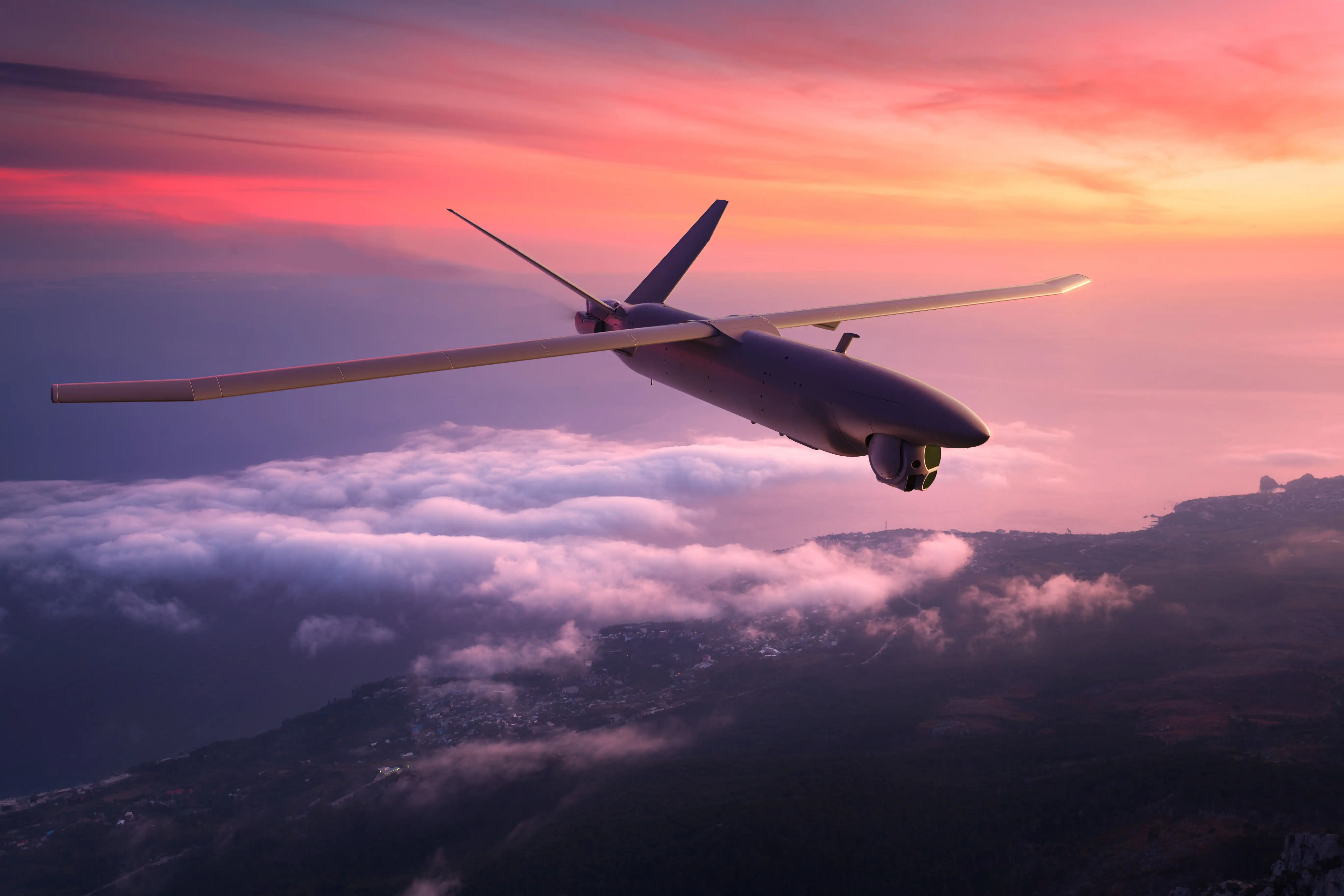 3D render of the M2 unmanned aircraft flying above the clouds at sunset