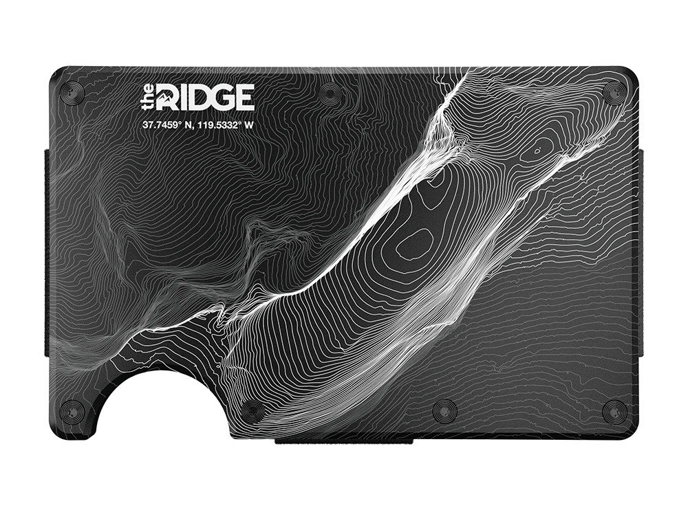 Metal wallet with a laser-etched topographic pattern on a clean white seamless background